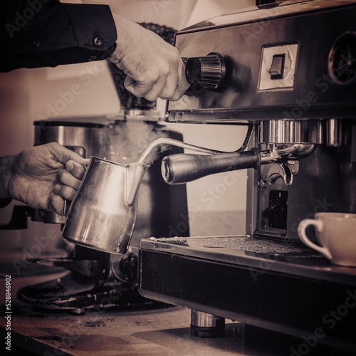 Cropped hands of person making coffee