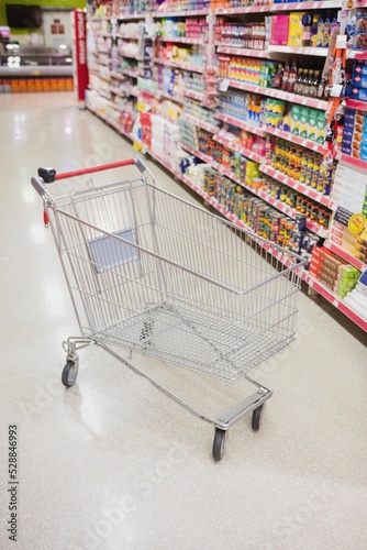 High angle view of empty shopping cart in aisle