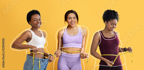 Smiling african american young females, overweight ladies drawn around, checking waist with measuring tape