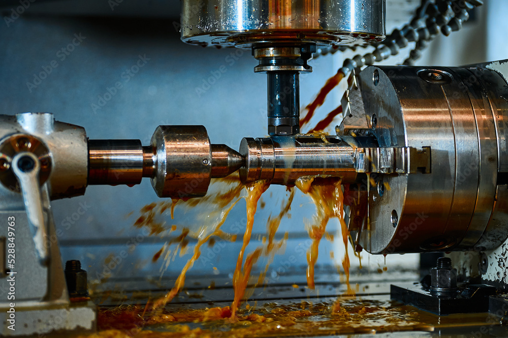 Processing metal detail with lathe machine tool in workshop Processing metal detail with lathe machine tool in workshop