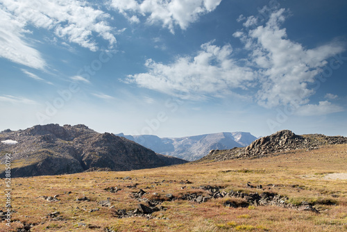 Landscape in the Beartooth Mountains with low hanging haze in sky due to smoke from Pryor Mountain wildfire burning in Montana and Wyoming photo