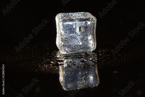 ice cubes on black table background. © peterkai