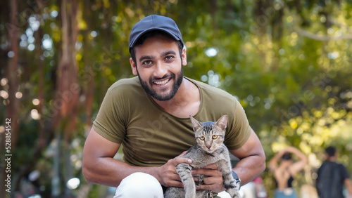 Canvas Print boy and wild cat looking at camera