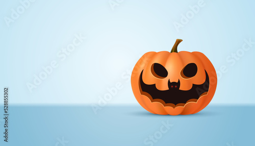 Halloween pumpkin and bat on a light background.
