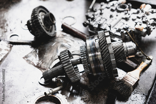 Gear clutch cogwheel Transmission Control Module automobile old used auto part repair service in garage.