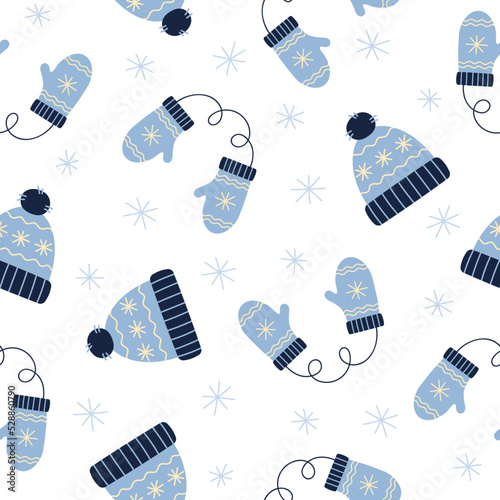 Seamless pattern of blue winter hat and mittens. Winter elements on white background. Doodle style. 