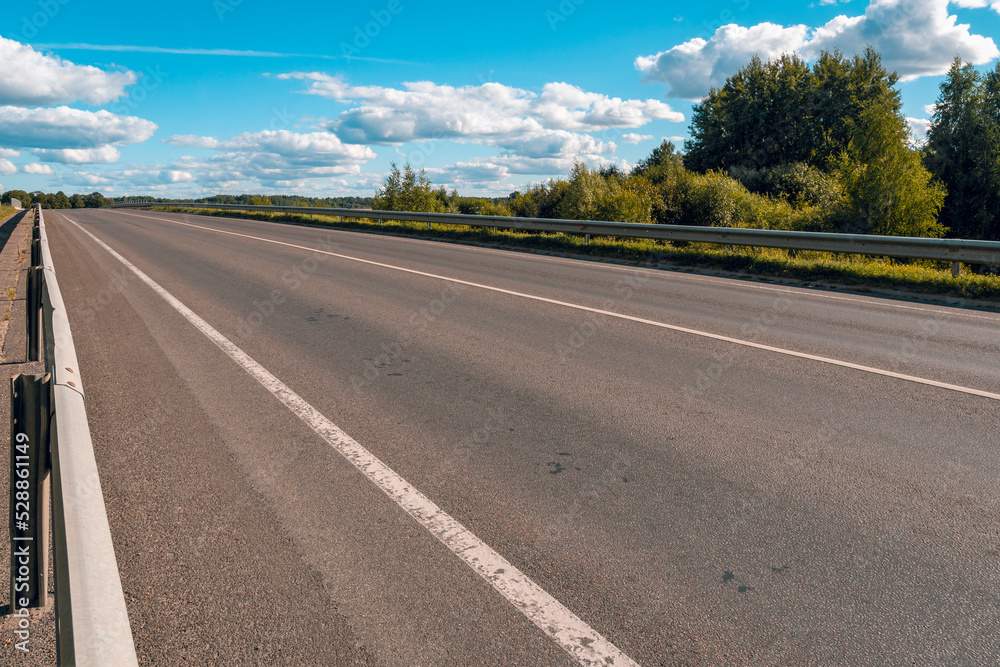Fototapeta premium Empty asphalt road ground with metal safety barrier