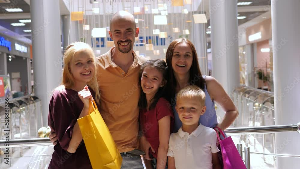 Portrait of a big happy family in a shopping mall with shopping bags. Portrait of a big happy family in a shopping mall with shopping bags.