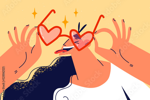 Smiling girl in heart shaped sunglasses
