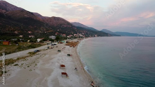 Sunset on the beach, mountain view in Albania. photo