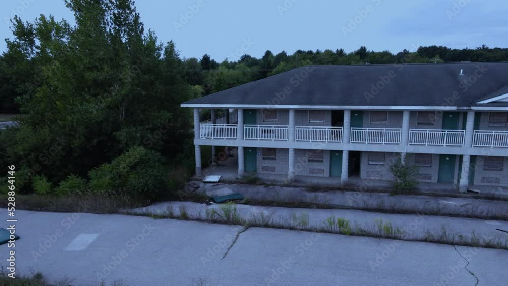 An overgrown abandoned hotel by an old racetrack. Day for night. An overgrown abandoned hotel by an old racetrack. Day for night.