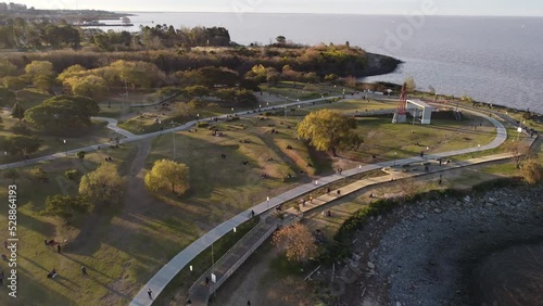 Aerial view of busy Vicente Lopez coastal park during sunset photo