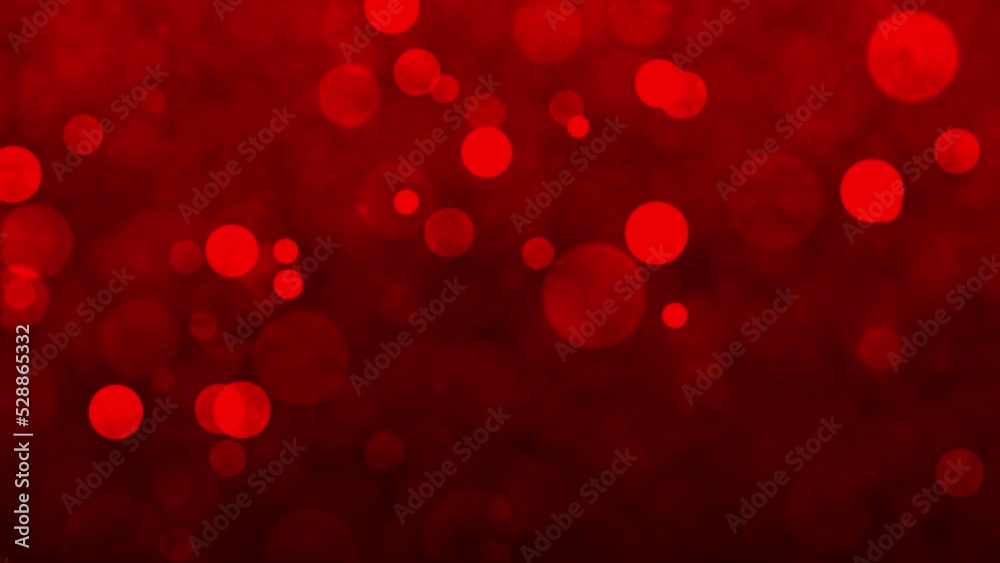 Red animated background with light particles across the screen. Lens focus on red background animation for christmas. Faded red particles glowing on the screen