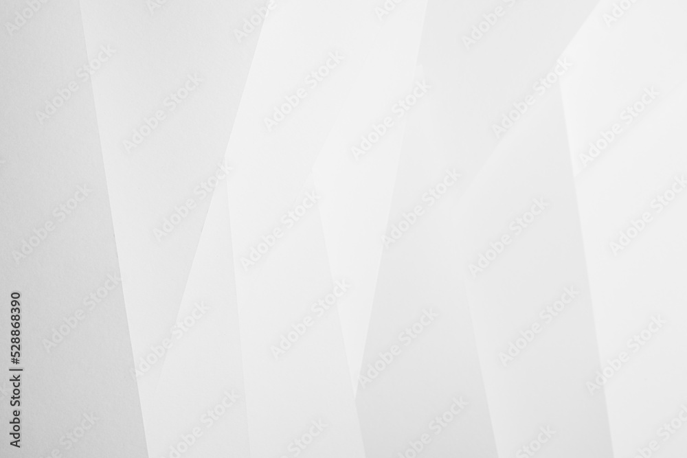 White abstract geometric background with soft light vertical oblique stripes with crossing and angles as pattern in simple monochrome modern style. White abstract geometric background with soft light vertical oblique stripes with crossing and angles as pattern in simple monochrome modern style.