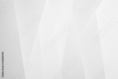 White abstract geometric background with soft light vertical oblique stripes with crossing and angles as pattern in simple monochrome modern style.
