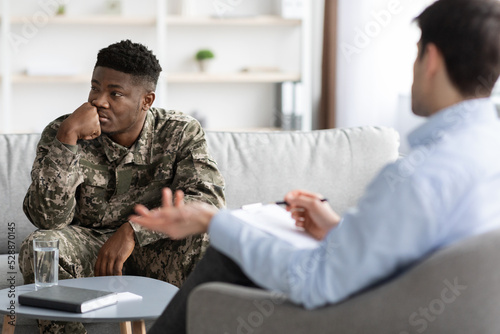 Depressed black guy combat having therapy session with psychologist