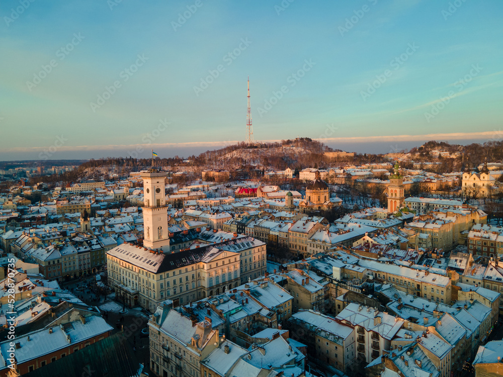 aerial view of lviv city hall on sunset