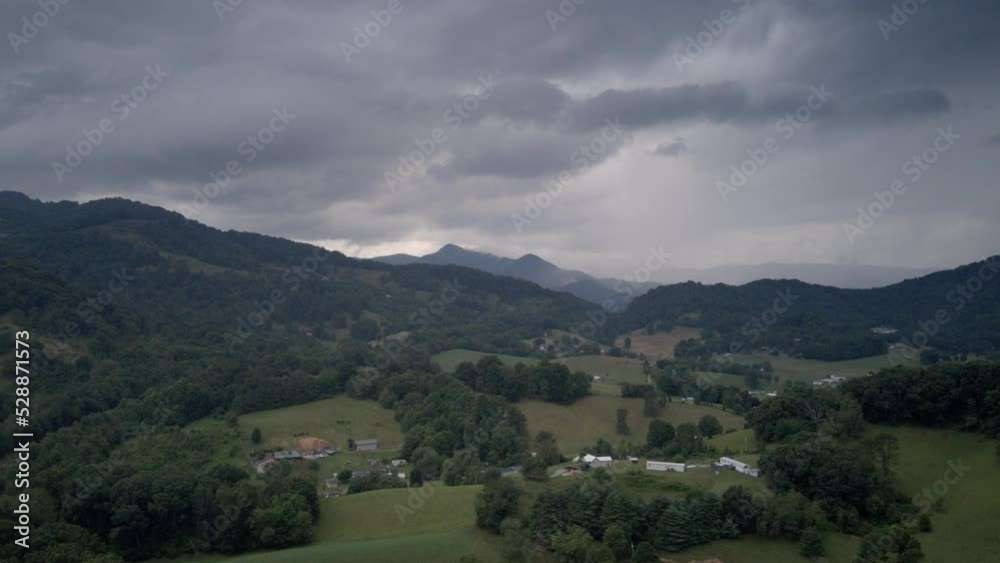 Aerial hyperlapse timelapse of Interstate 40 with storm clouds overhead and traffic underneath.