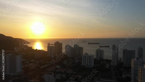 Wallpaper Mural Sunset view of city buildings near ocean in Latin America Torontodigital.ca