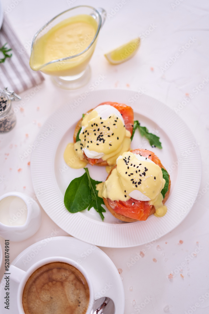 Eggs Benedict with Cream cheese and Smoked salmon on a plate Eggs Benedict with Cream cheese and Smoked salmon on a plate