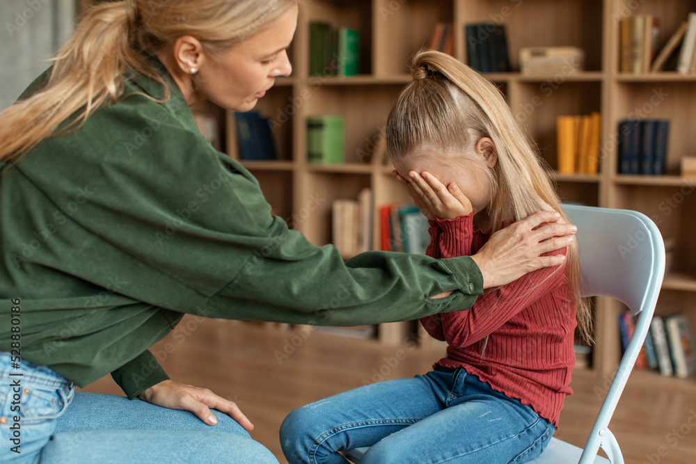 Children need help. Little girl crying in psychologist's office ...