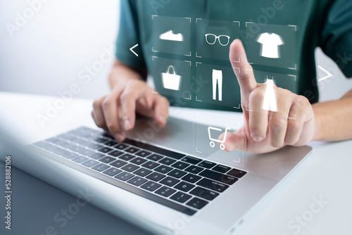person using computer and touch virtual screen online shopping. And online payment option or digital wallet online transaction concept.