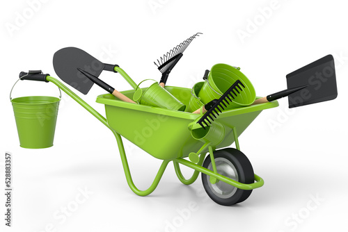 Fotografia Garden wheelbarrow with garden tools like shovel, watering can and fork on white