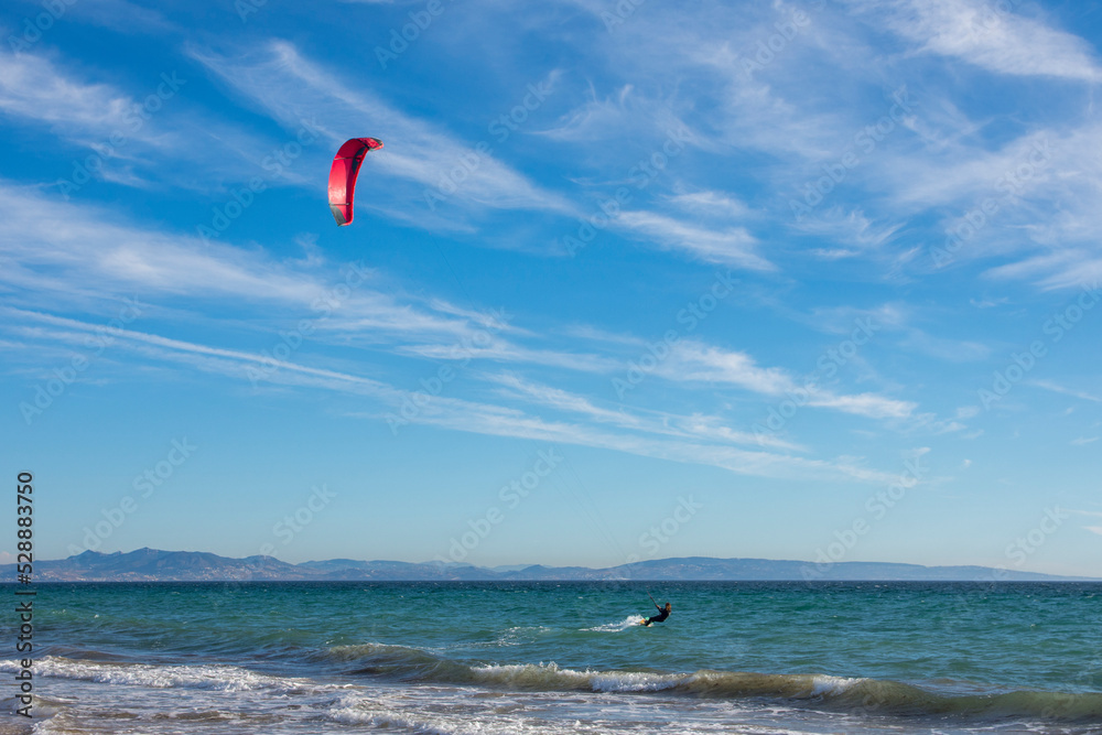 Kite-surfing. Many silhouettes of kites in the sky. Holidays on nature. Artistic picture. Beauty world. Kite-surfing. Many silhouettes of kites in the sky. Holidays on nature. Artistic picture. Beauty world.