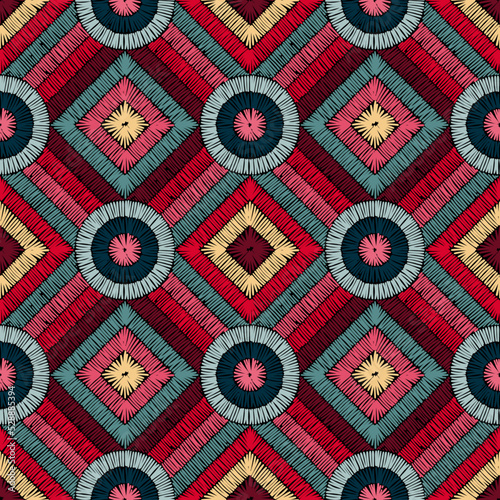 Seamless pattern in patchwork style. Embroidered print for carpet, textile, wallpaper, wrapping paper. Ethnic and tribal motifs. Handwork. Vector illustration.