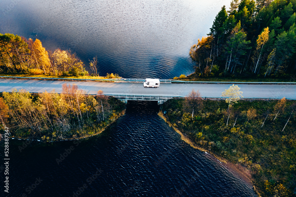 Aerial view Caravan trailer or Camper rv on the bridge over the lake in Finland.