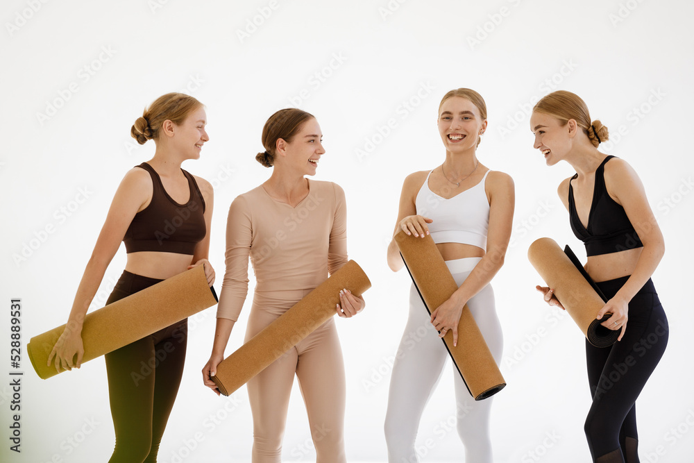 Naklejka premium Cheerful group of athletic women having fun together