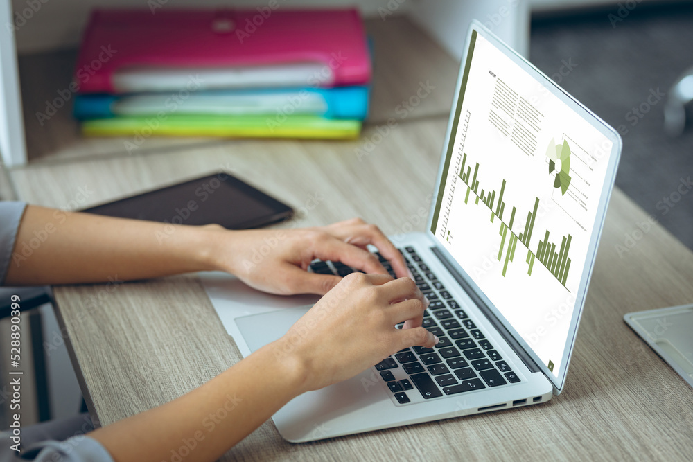 Caucasian businesswoman using laptop with data processing Caucasian businesswoman using laptop with data processing