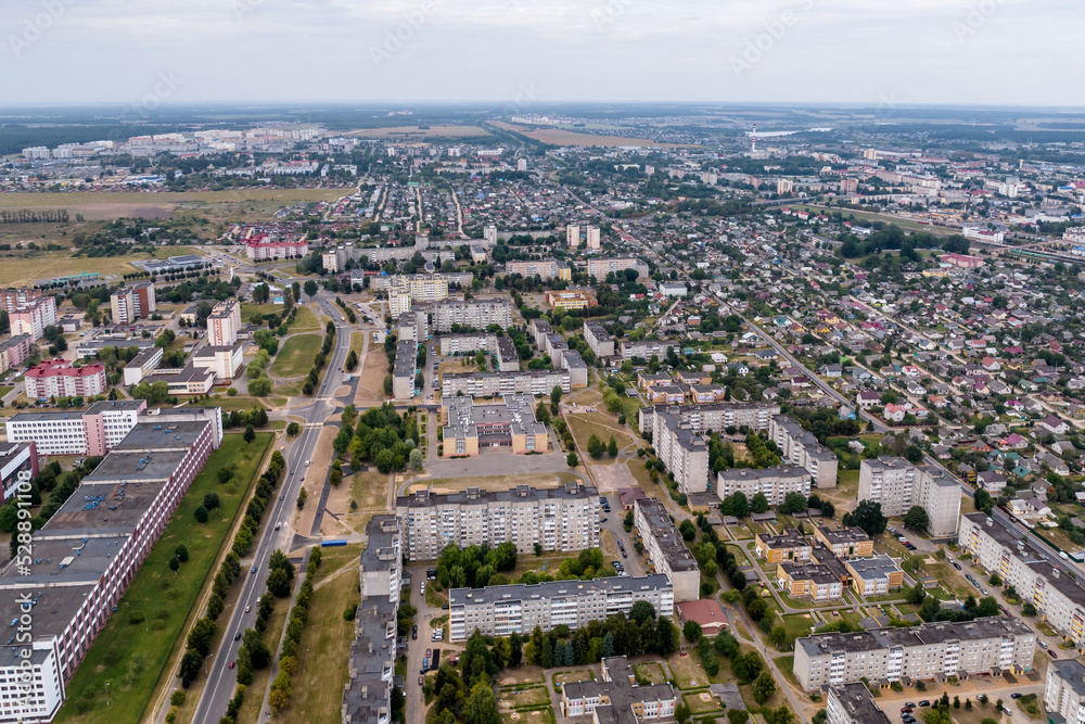 panoramic view from a great height of a small provincial town with a private sector and high-rise apartment buildings