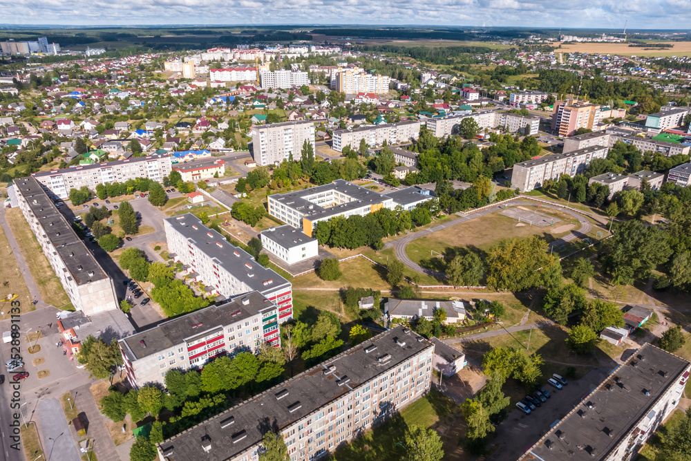 panoramic view from a great height of a small provincial town with a private sector and high-rise apartment buildings