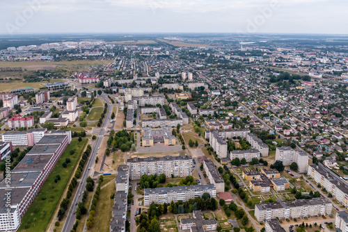 Fototapeta Naklejka Na Ścianę i Meble -  panoramic view from a great height of a small provincial town with a private sector and high-rise apartment buildings