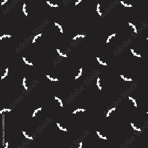 Seamless pattern with bats on black background.