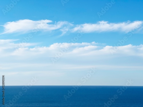 Blue sea water and sky clouds. © OLENA