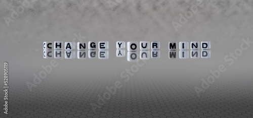 change your mind word or concept represented by black and white letter cubes on a grey horizon background stretching to infinity