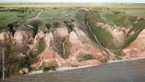 Drone video of beautiful rock cliff near azzure sea photo