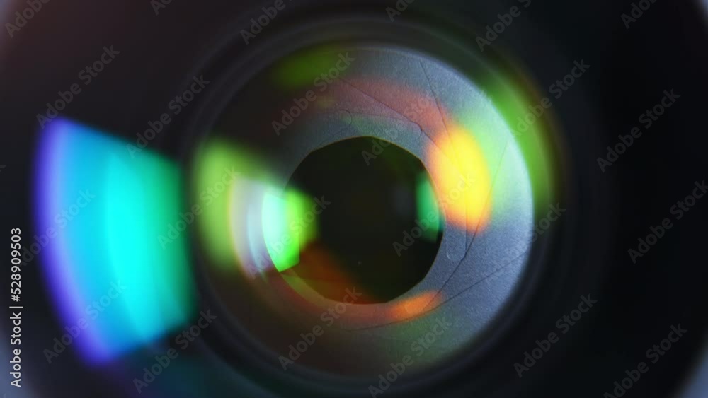 Close-up aperture blades inside of professional camera lens with color reflections. High quality 4k footage Close-up aperture blades inside of professional camera lens with color reflections. High quality 4k footage