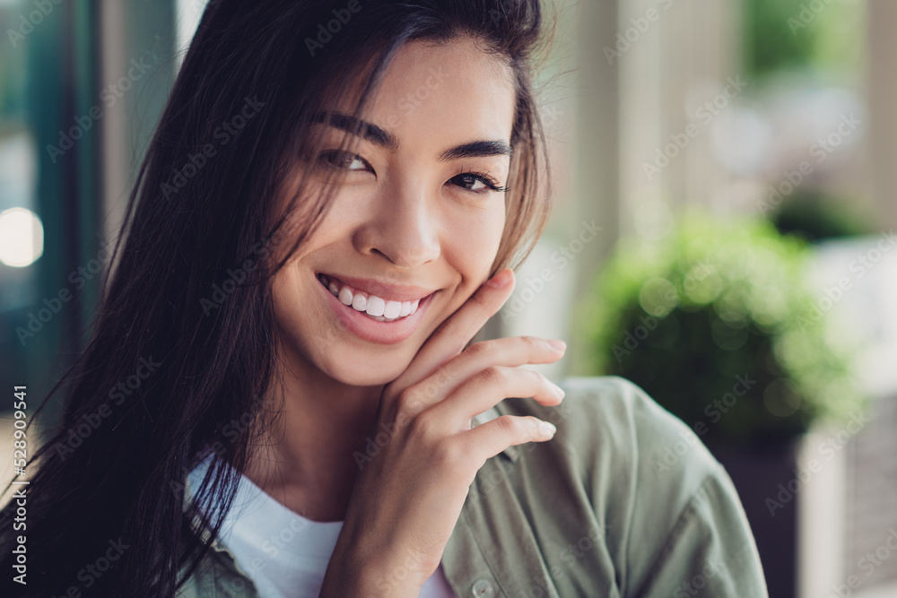 Photo of dreamy cheerful girlfriend wear green outfit smiling arm cheek outdoors city residential complex Photo of dreamy cheerful girlfriend wear green outfit smiling arm cheek outdoors city residential complex