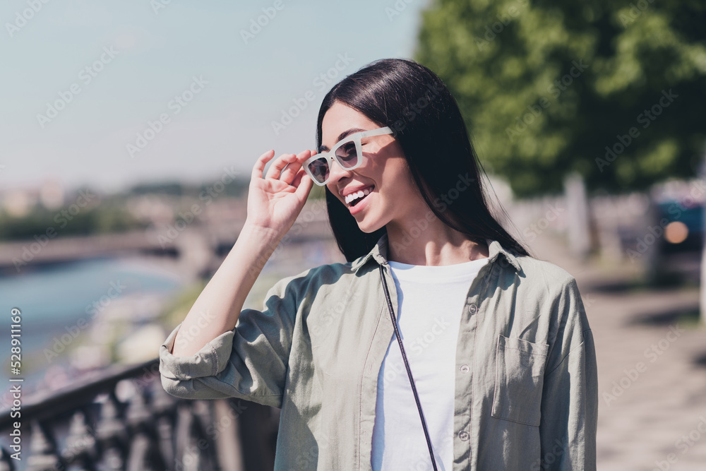 Photo of cheerful pretty lovely lady touch new eyewear enjoy sun sunny weather walk outdoors town Photo of cheerful pretty lovely lady touch new eyewear enjoy sun sunny weather walk outdoors town
