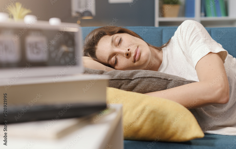 Relaxed woman sleeping on the sofa at home Relaxed woman sleeping on the sofa at home