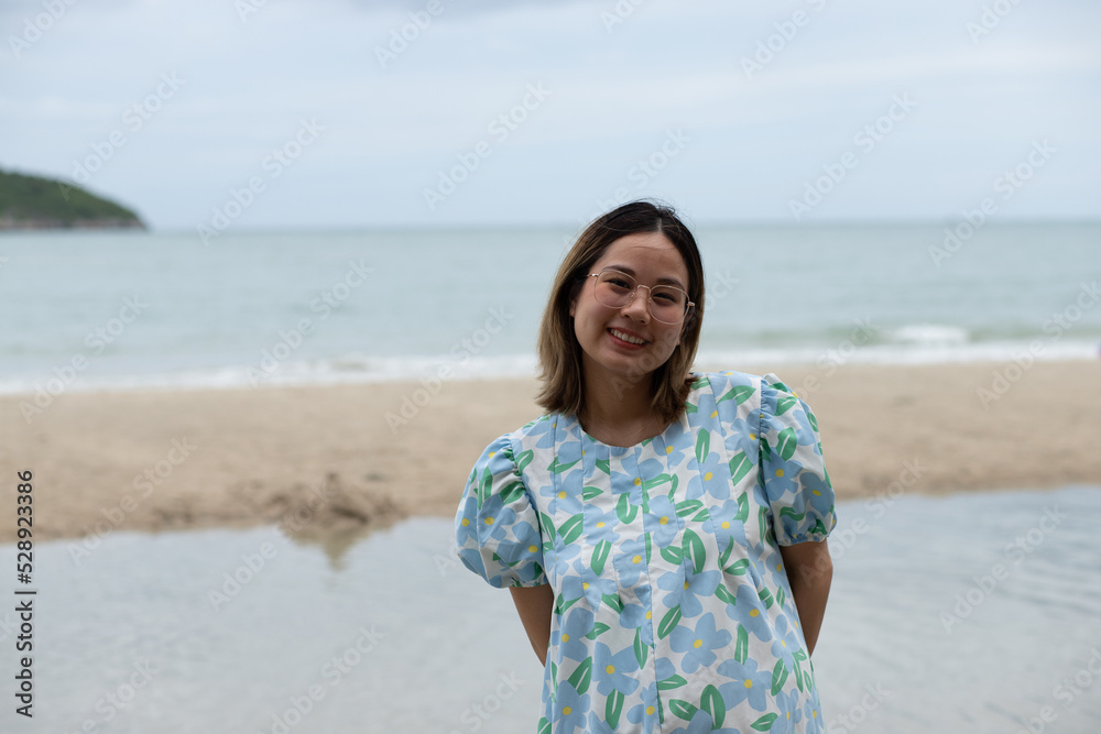 Beautiful young pregnant woman walking on the beach feel peace Beautiful young pregnant woman walking on the beach feel peace
