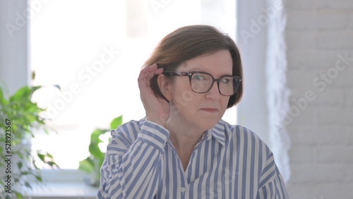 Portrait of Senior Woman Listening Secret Carefully Information