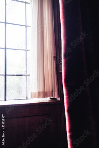 Curtains Around Leaded Windows In An English Country Manor House