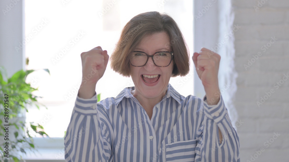 Excited Senior Woman Celebrating Success Excited Senior Woman Celebrating Success