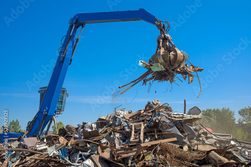scrap metal grab on a bright sunny day
