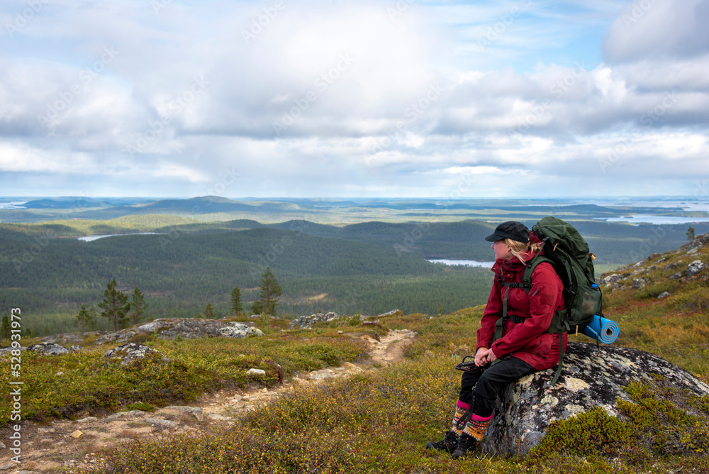 Woman hiking in Lapland Finland