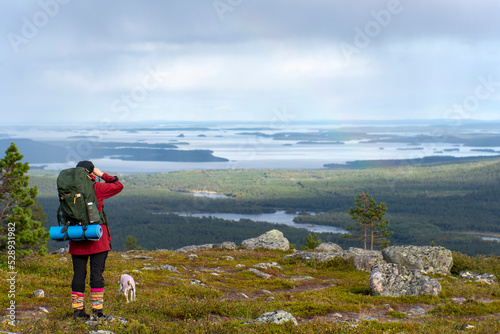 Woman hiking in Lapland Finland photo